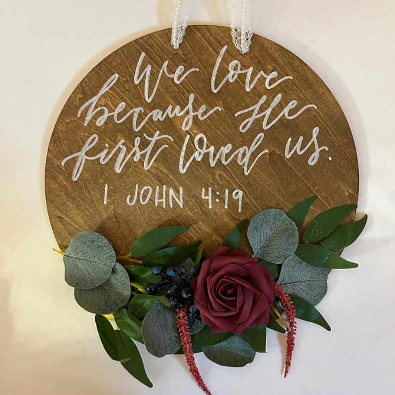 Round Wooden Sign We Love Because He Loved Us 